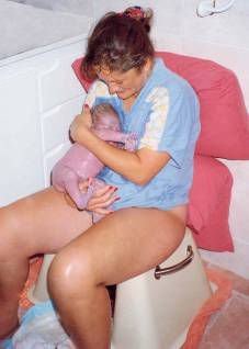 Photo of Joanne with baby on Birthing Seat
