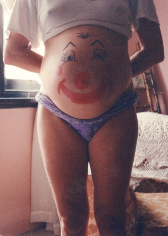 Painted belly of pregnant woman